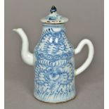 An 18th century Chinese teapot Of slender form with removable lid and scroll handle,