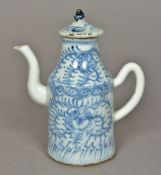 An 18th century Chinese teapot Of slender form with removable lid and scroll handle,