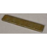 A Chinese bronze scroll weight Extensively worked with calligraphic script. 26 cm long.