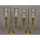 A pair of Victorian brass adjustable candelabra Each mounted with twin etched glass shades.