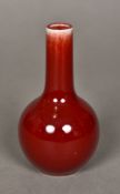 A small Chinese sang de boeuf porcelain vase Of ovoid form, with elongated neck,