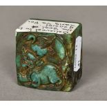 A Chinese carved turquoise and russet jade seal Worked with a temple lion and crane,