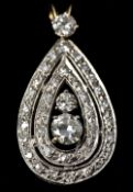 An unmarked white gold, diamond set pendant Of drop form, centrally set with a 0.
