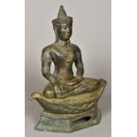 An Eastern cast bronze figure of Buddha Modelled in Bhumisparsa, seated on a navette form cushion,