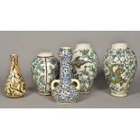 A collection of five Isnik type pottery vases Each typically decorated. The largest 33 cm high.