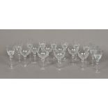 A set of ten cut lead crystal glass wine glasses With facet and floral cut decorations;