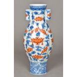 A Chinese porcelain vase Of lobed form, decorated with bats amongst stylised clouds,