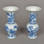 A pair of Chinese blue and white porcelain baluster vases Each decorated with flowering boughs in