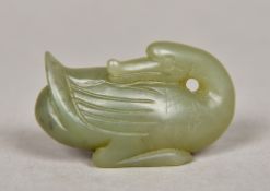 A Chinese carved spinach jade model of a goose Naturalistically modelled. 5.5 cm long.