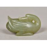 A Chinese carved spinach jade model of a goose Naturalistically modelled. 5.5 cm long.