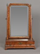 A George III walnut toilet mirror With bevelled plate and three curved frieze drawers,