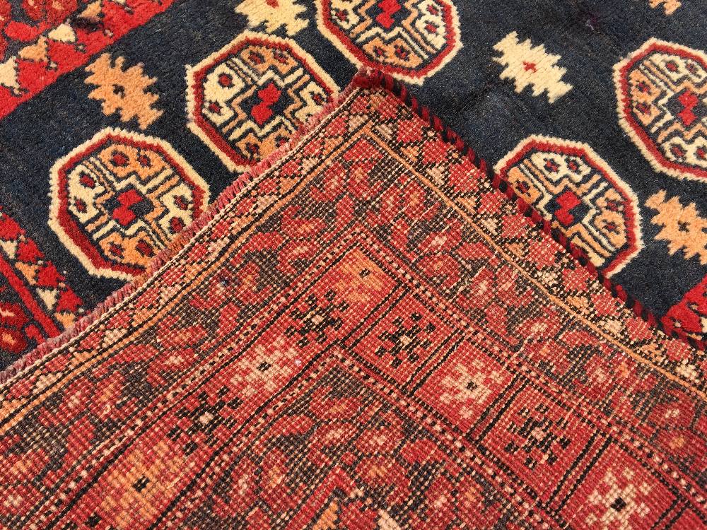 A Turkman wool rug The midnight blue field enclosing two rows of seven guls interspersed with - Image 2 of 2