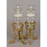 A pair of Victorian gilt and enamel decorated clear cut glass vases Each mounted on a mask and