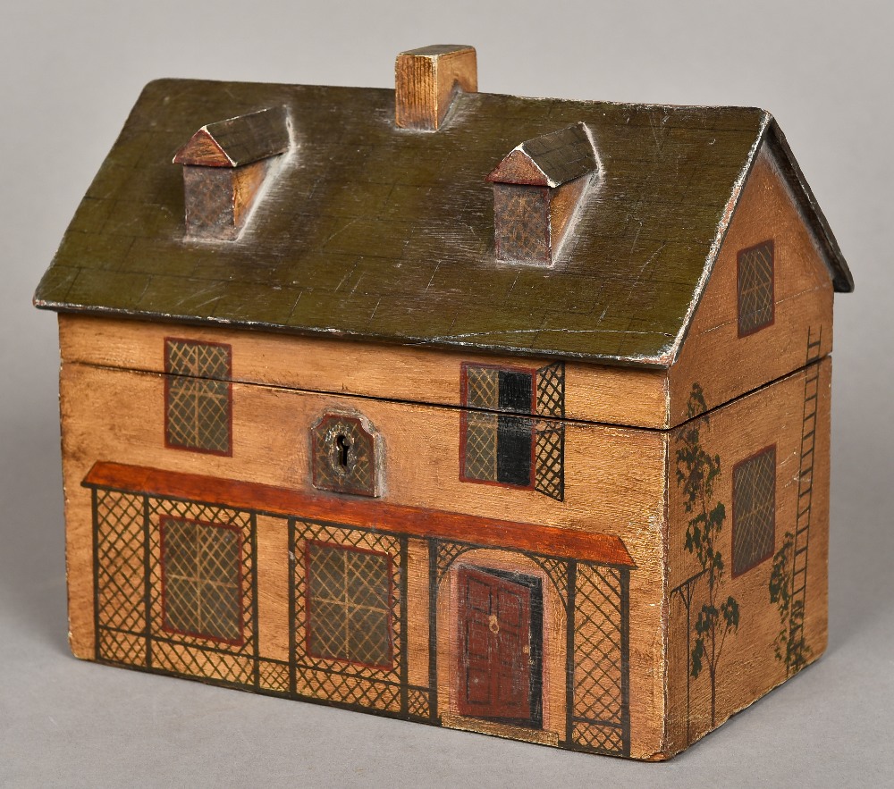 A 19th century polychrome painted wooden tea caddy Modelled in the form of a rustic cottage,