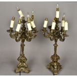 A pair of 19th century bronze candelabra Each with five scroll cast branches above the cast stem,