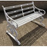 A white painted cast iron garden bench, possibly Coalbrookdale Italian pattern. 141.5 cm wide.