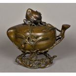 A 19th century Chinese patinated bronze censor Formed as a peach with a removable pierced lid
