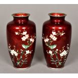 A pair of Japanese white metal mounted cloisonne vases Worked with birds amongst prunus blossom,