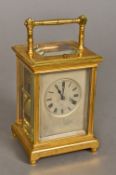A 19th century lacquered brass cased repeating carriage clock The silvered dial with Roman numerals.