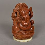 A carved gold stone figure Ganesh Typically worked. 10 cm high.