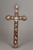 A Chinese mother-of-pearl inlaid wooden (possibly hongmu) cross With trailing foliate designs,