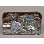 A late 19th century Japanese lacquered tin Of hinged rounded rectangular form,