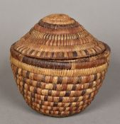 A North American Native Indian woven storage basket Of typical construction with a domed removable