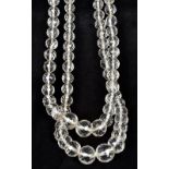 A double strand facet cut rock crystal bead necklace Mounted with a silver clasp.