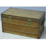A late 19th century French travelling trunk Of wooden banded form with brass lock plates.