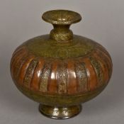 A 17th/18th century Indian brass and copper lota Engraved with figures,