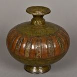 A 17th/18th century Indian brass and copper lota Engraved with figures,