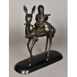 A Chinese bronze censor and cover Worked as Shou riding a deer whilst holding a peach and scroll,