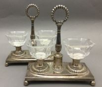 A pair of 19th century Continental silver table salts Each with twin glass reservoir and central