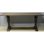 An 18th century and later oak refectory table The cleated plank rectangular top above twin capital
