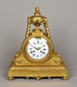 A 19th century gilt bronze mantel clock With cast acanthus scrolls and trailing husks,