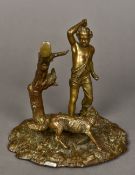 A 19th century patinated bronze group Formed as a woodsman and a wolf before a tree. 19 cm high.