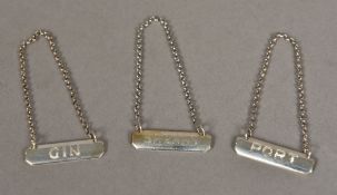 A pair of silver decanter labels, hallmarked London 1936,