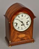 A mahogany lancet cased mantle clock The white painted dial signed Comitti,