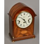 A mahogany lancet cased mantle clock The white painted dial signed Comitti,