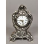 An unmarked silver cased Tiffany desk clock The case of scrolling rococo form,