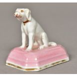 A Chamberlains Worcester porcelain model of a dog Seated wearing a red collar on a pink painted and