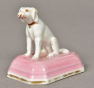 A Chamberlains Worcester porcelain model of a dog Seated wearing a red collar on a pink painted and