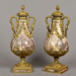 A pair of ormolu mounted carved marble baluster vases and covers Each with twin handles modelled as