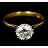 An 18 ct gold platinum and diamond solitaire ring The claw set stone spreading to approximately 1.