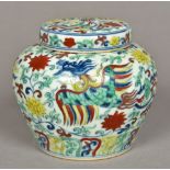 A Chinese porcelain Doucai jar and cover Of squat form, decorated with phoenix,