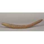 An Australian, possibly Aboriginal, carved wooden boomerang Of typical form. 59.5 cm long.