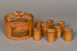 A 19th century mauchline ware spice box Of castellated circular form decorated with views of