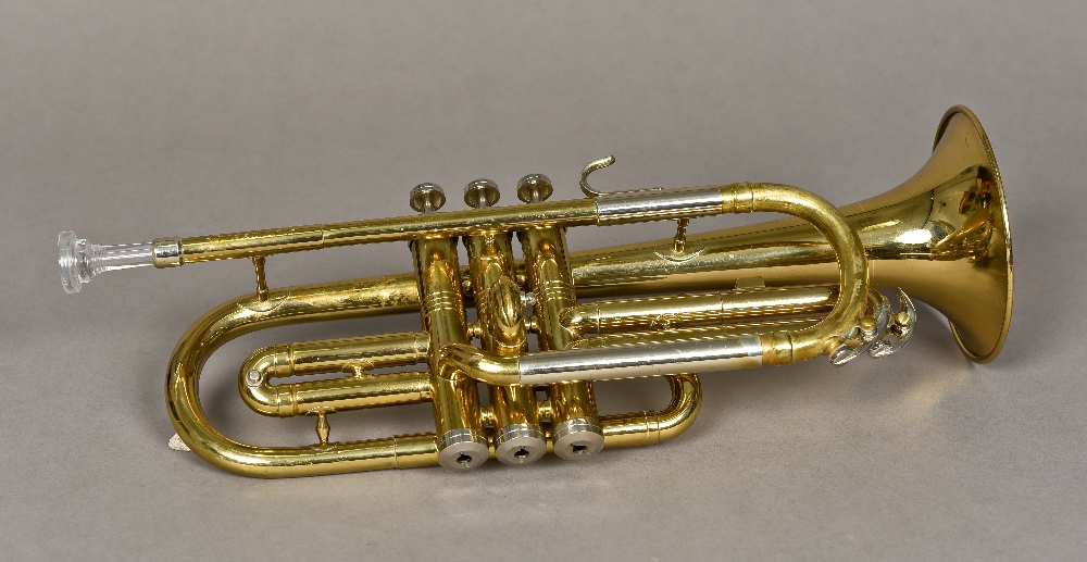 An American cornet by Conn, stamped M73111 Cased.