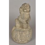 An antique Chinese stone carving of dog-of-fo Modelled seated on a drum with a ball at his feet.