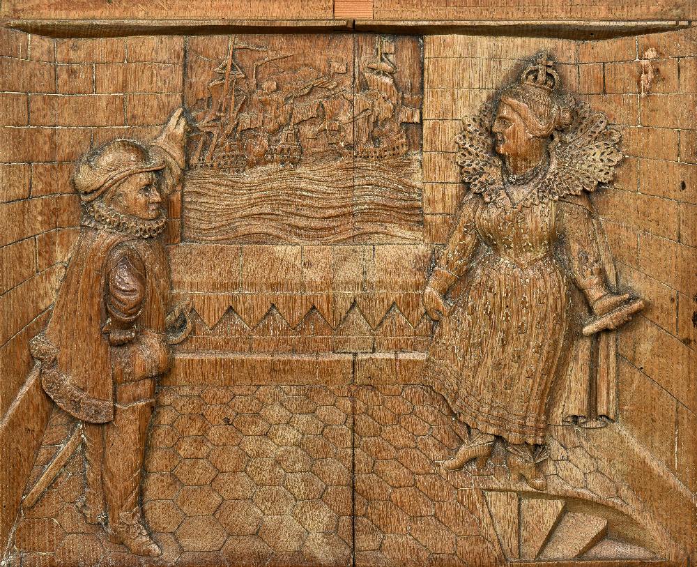 A 19th century oak panel Carved with Queen Elizabeth I and Sir Francis Drake observing the fleet